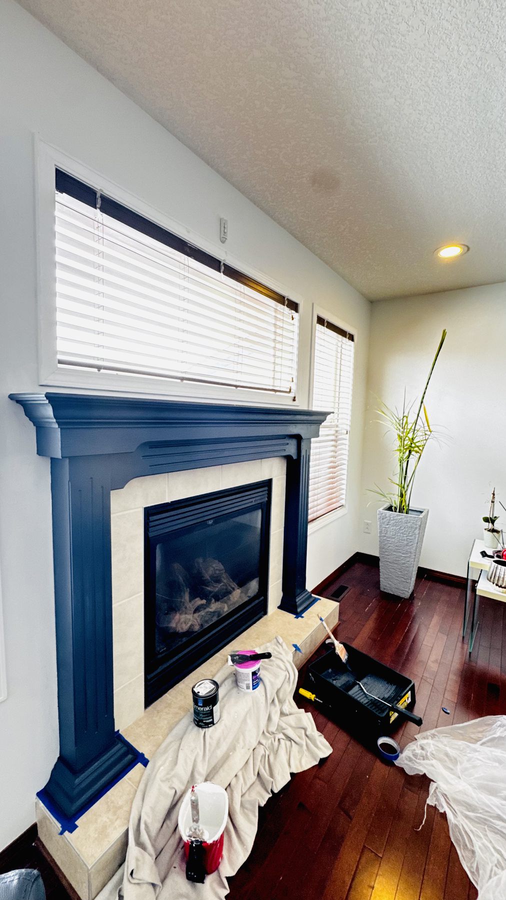 Fireplace mantle freshly painted a rich navy blue