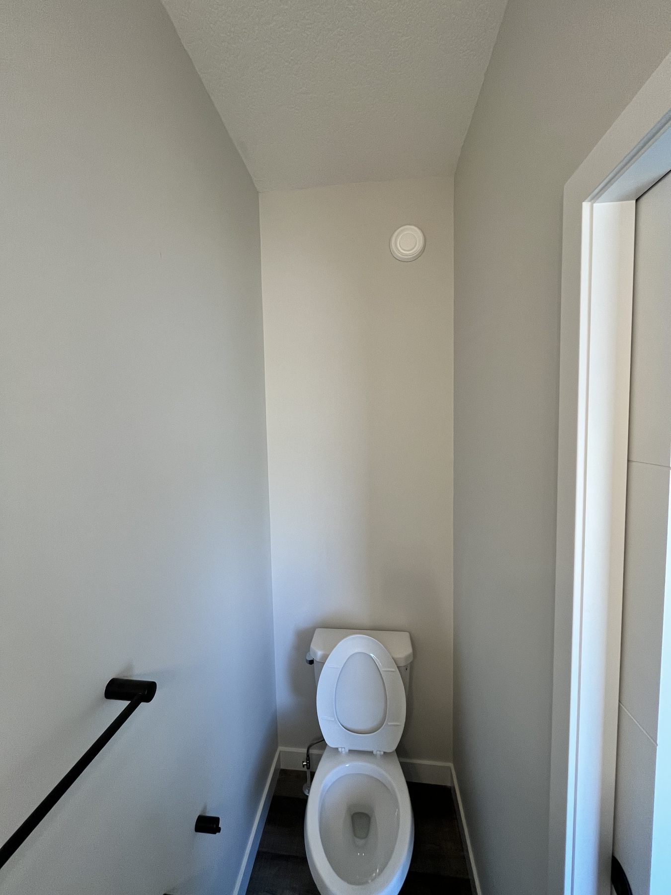 Bathroom wall stripped bare and prepped, ready for new wallpaper