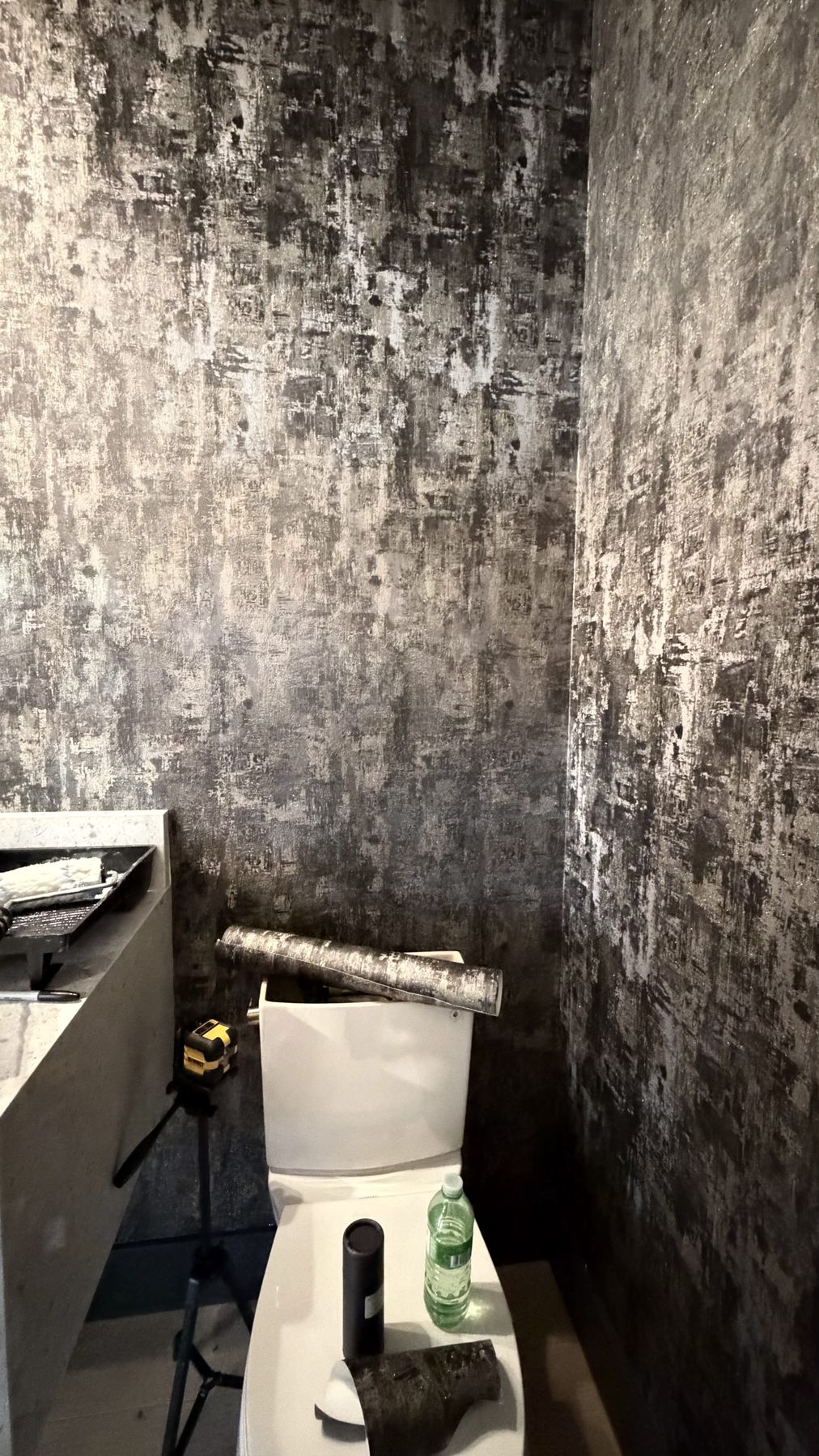 Bathroom with textured charcoal wallpaper