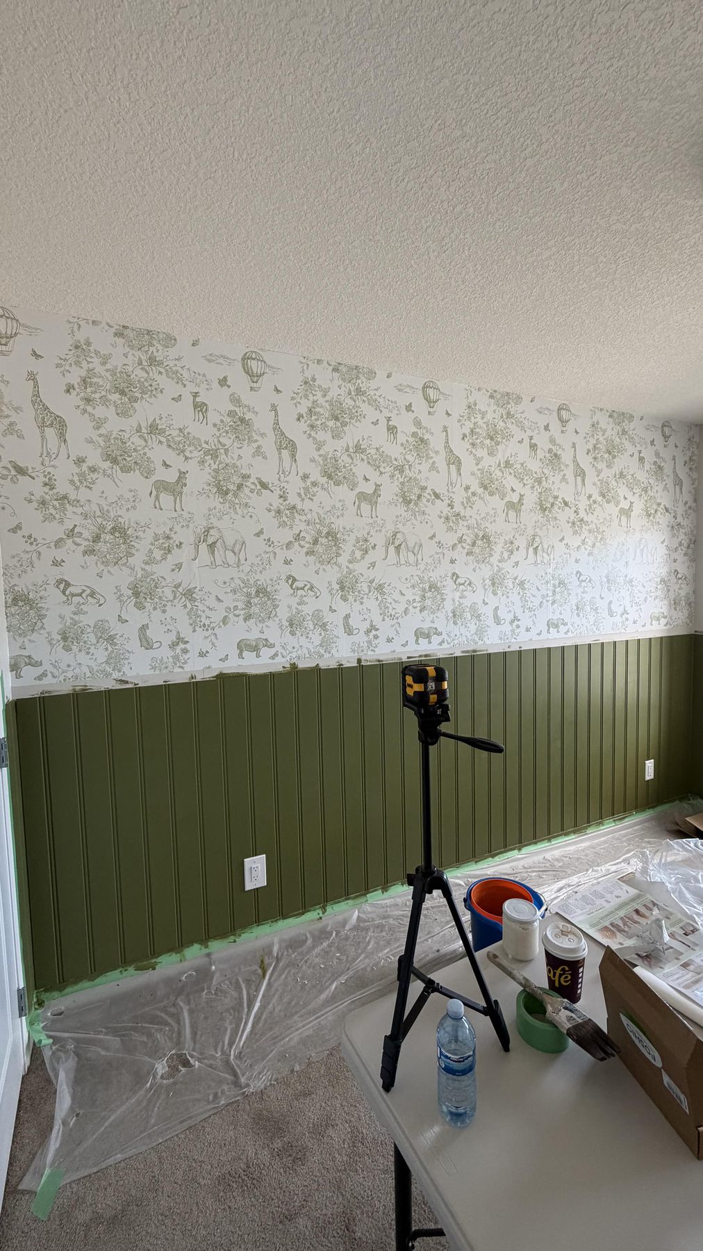 Room after floral wallpaper and painted wainscoting