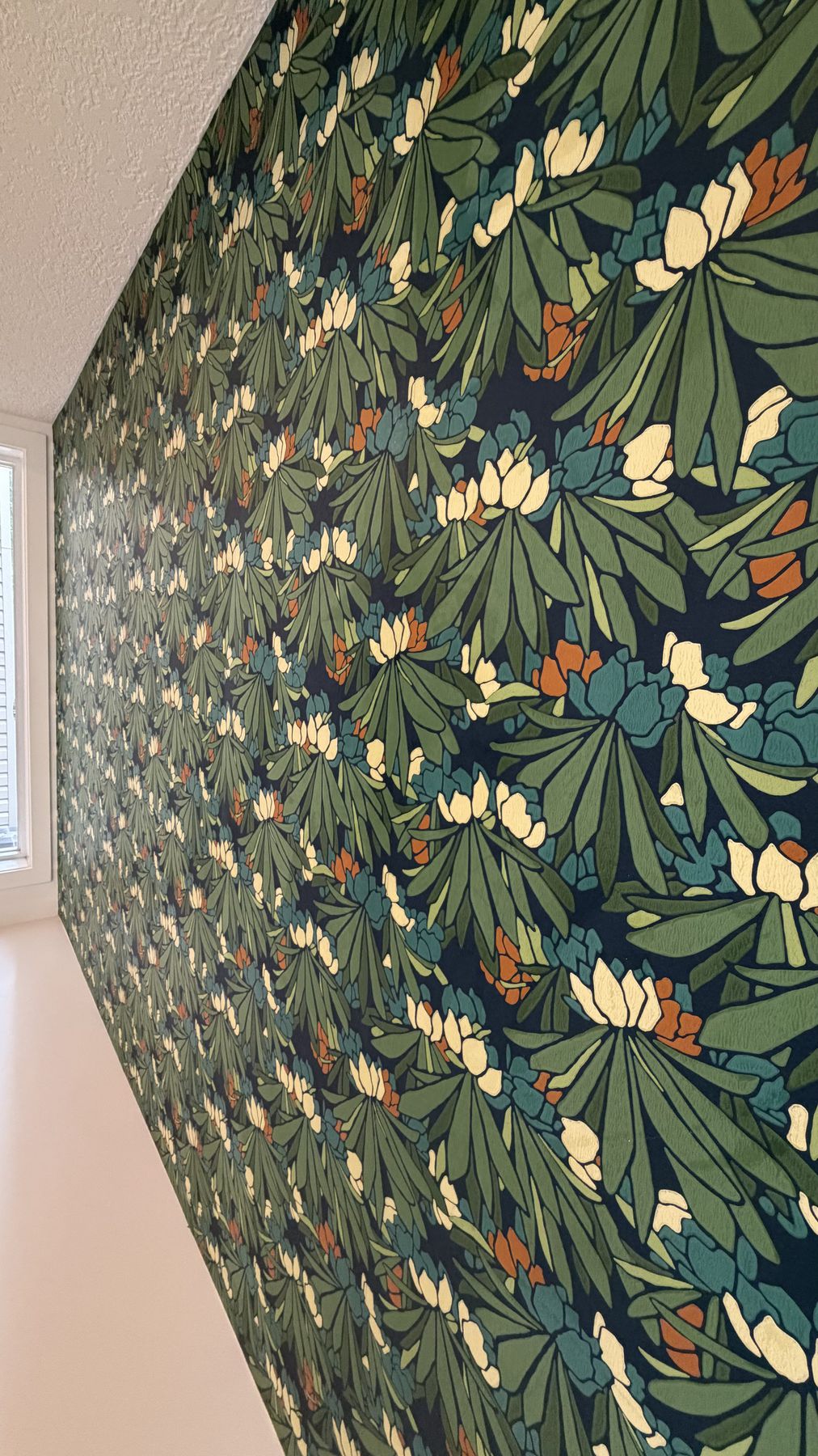 Botanical green wallpaper accent wall